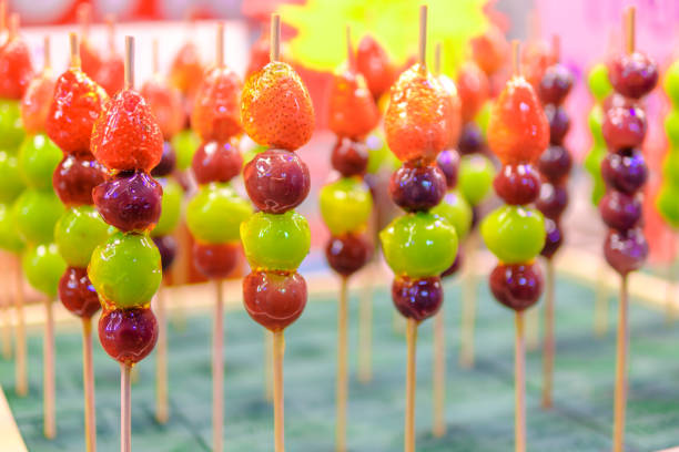 Beautifully arranged sugar coated grape and strawberry. tang hu lu
